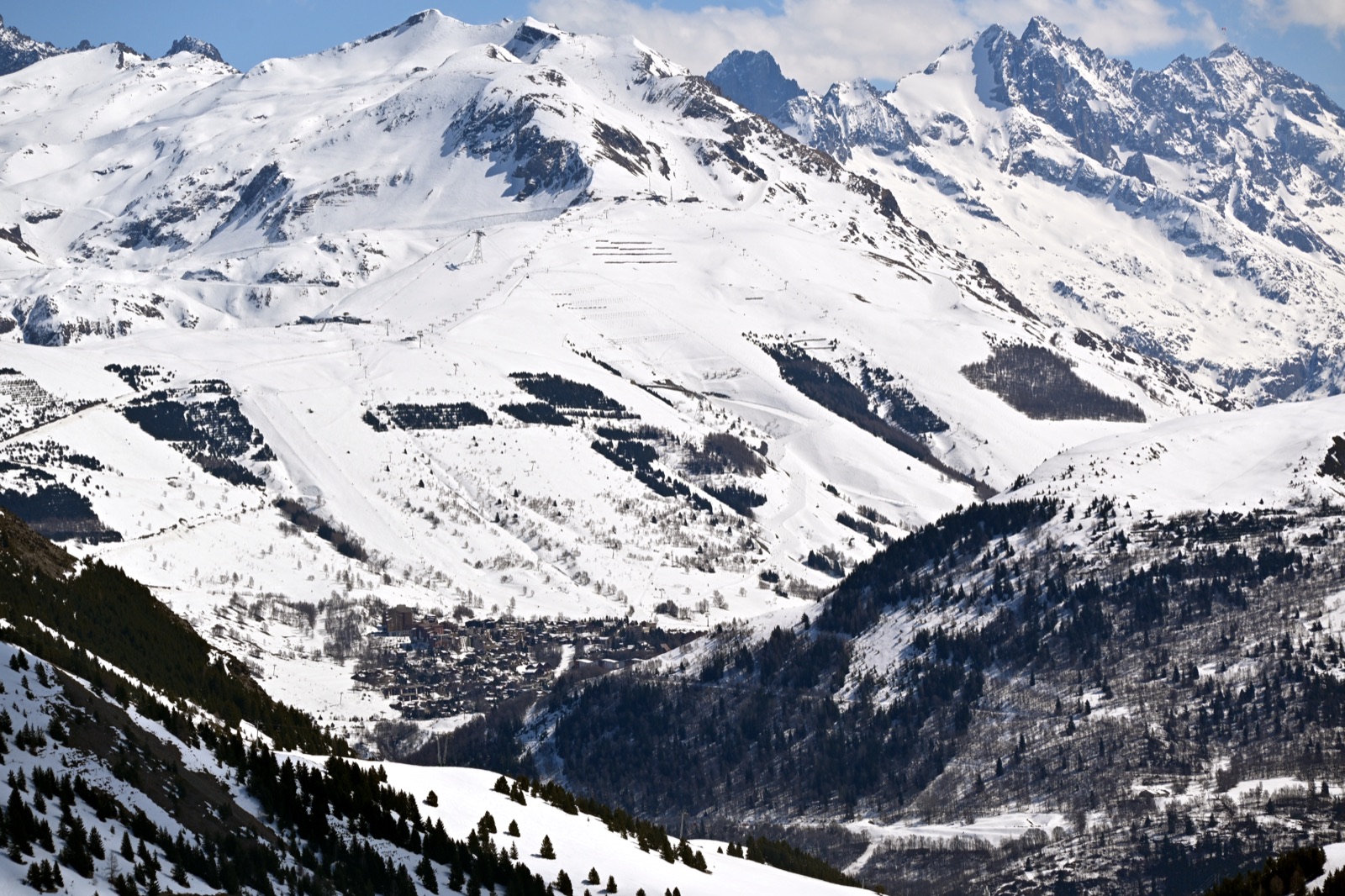 The Mont de Lans glacier above Les Deux Alpes, with the resort village visible in the valley below
