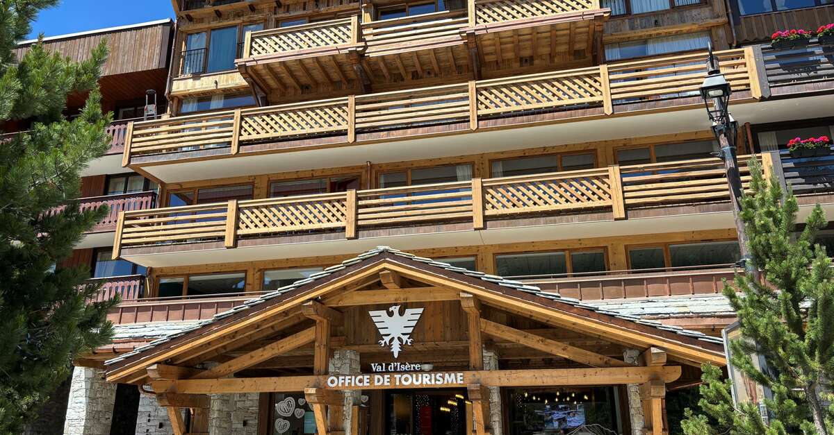 The timber entrance of the Val d'Isère tourist office in summer